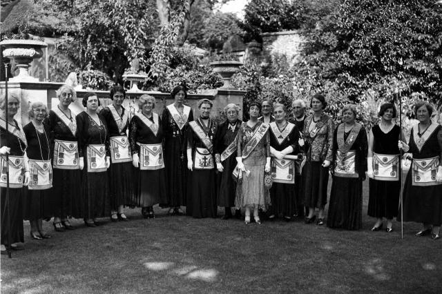 Group belonging to Freemasonry for Men and Women, showing a group of women (and one man) in regalia