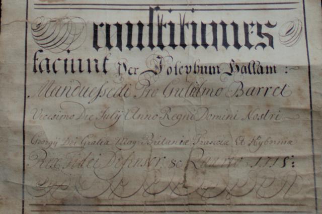 Pale parchment with back text written in Latin