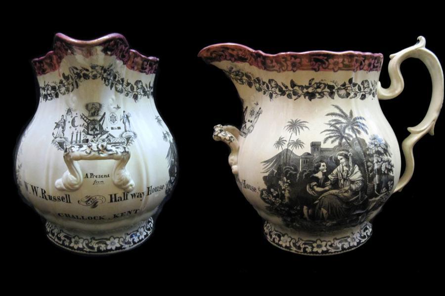 White jug with black transfer-printed designs, including masonic symbols