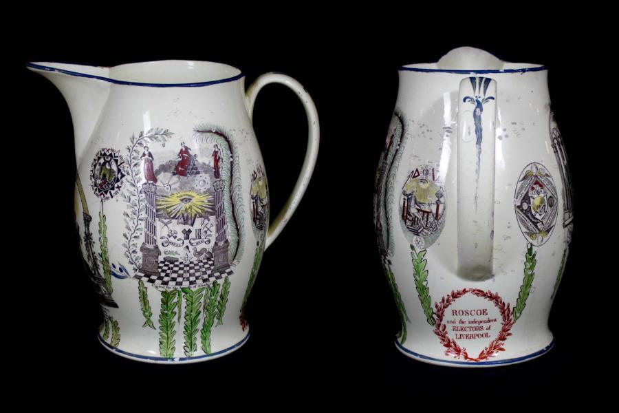 White jug with coloured transfer printed design featuring masonic emblems