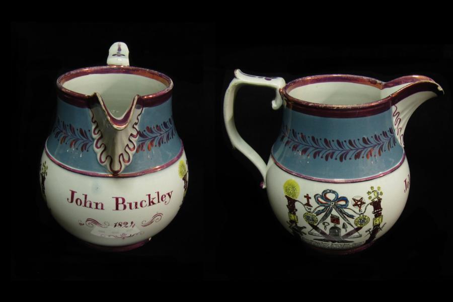 Small white jub with blue and purple decoration, including masonic symbols