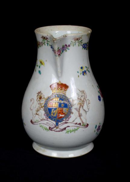 Front view of a white jug showing the coat of arms of the Duke of Gloucester and Edinburgh