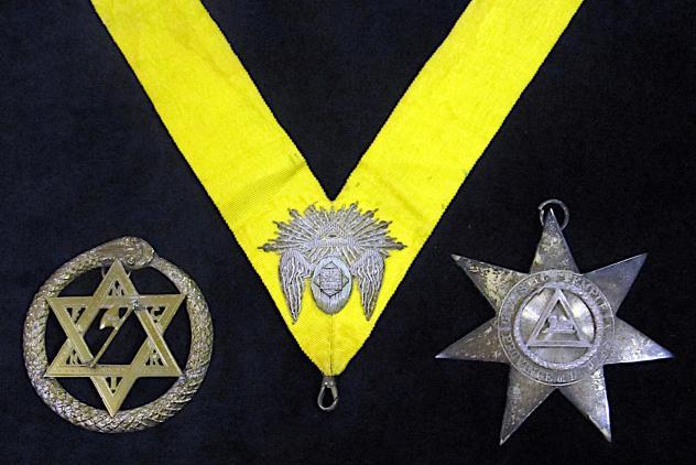 Three Ancient and Primitive Rite jewels (medals), the one in the centre is on a yellow ribbon